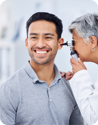 Doctor checking patient's ear